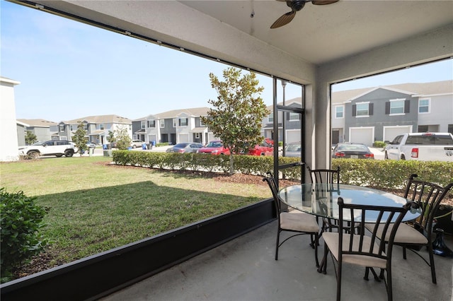 8680 Falling Blue Pl, Riverview, FL 33578 - sunroom / solarium featuring a residential view, ceiling fan, and outdoor dining area