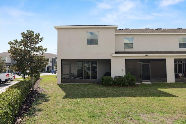 8680 Falling Blue Pl, Riverview, FL 33578 - back of property with a sunroom, a yard, and stucco siding