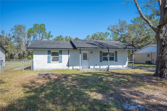 ranch-style house with central AC and a front lawn