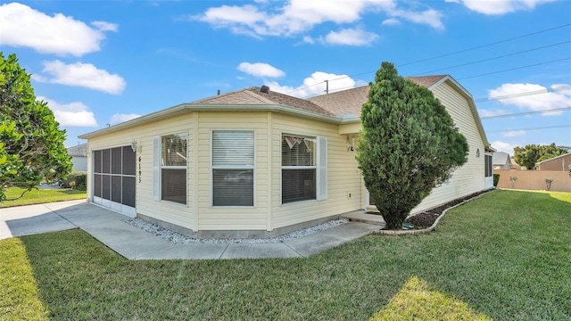 view of property exterior with a lawn