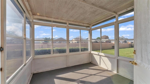 unfurnished sunroom with wood ceiling