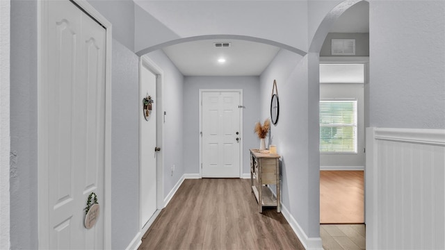 corridor featuring hardwood / wood-style floors