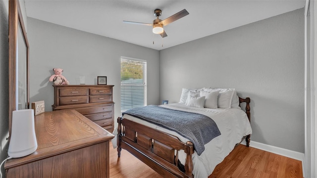 bedroom with ceiling fan and light wood-type flooring