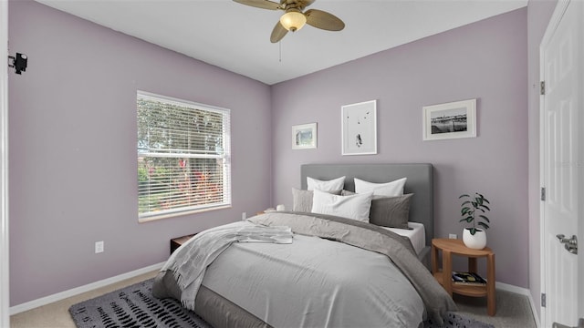 bedroom with baseboards, ceiling fan, and carpet flooring