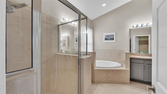 full bath featuring tile patterned floors, a garden tub, a shower stall, lofted ceiling, and vanity