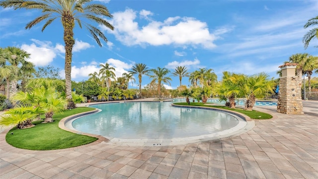 community pool featuring a patio area