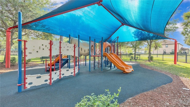 communal playground featuring fence