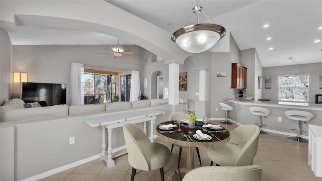 dining space with recessed lighting, arched walkways, light tile patterned floors, lofted ceiling, and ceiling fan