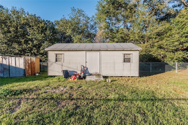 view of shed featuring a fenced backyard