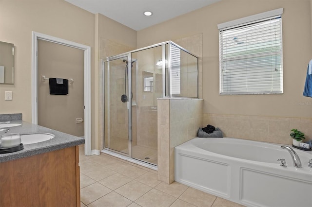 bathroom featuring separate shower and tub, tile patterned flooring, and vanity