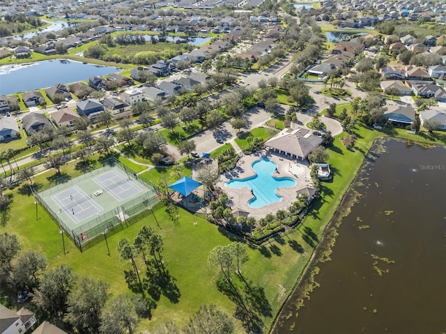 birds eye view of property with a water view