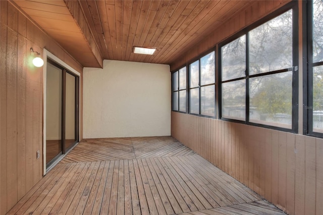 unfurnished sunroom featuring wooden ceiling