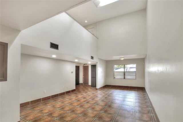 empty room featuring a high ceiling