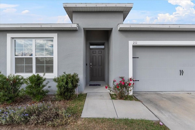 view of exterior entry featuring a garage