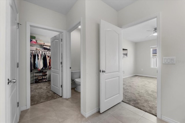 bathroom featuring tile patterned flooring and toilet