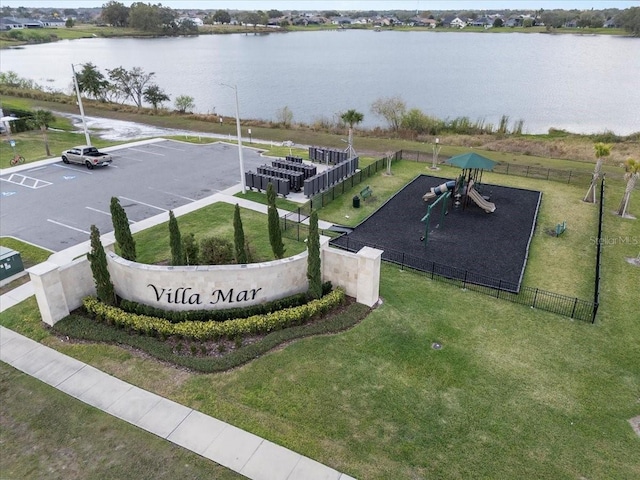 exterior space with a lawn and a water view