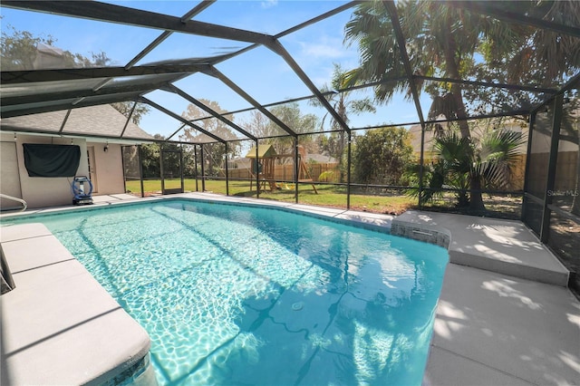 7410 Locksley Ln, Lakeland, FL 33809 - outdoor pool with a patio area, glass enclosure, and fence