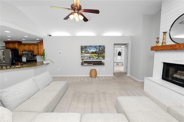 7410 Locksley Ln, Lakeland, FL 33809 - living room featuring recessed lighting, vaulted ceiling, a fireplace, light carpet, and a ceiling fan