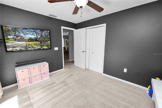7410 Locksley Ln, Lakeland, FL 33809 - unfurnished bedroom featuring ceiling fan, carpet, baseboards, and visible vents