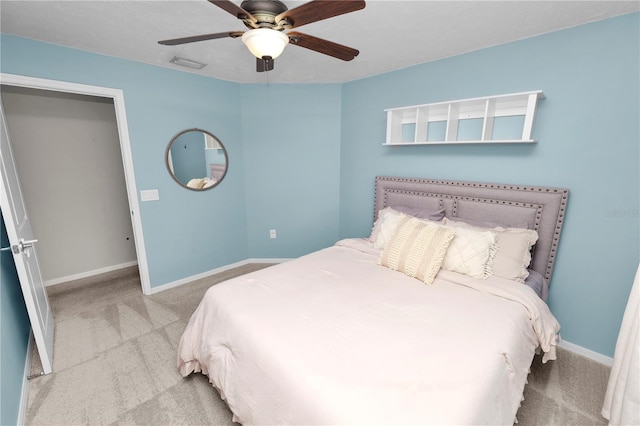 7410 Locksley Ln, Lakeland, FL 33809 - bedroom with carpet, visible vents, baseboards, and a ceiling fan