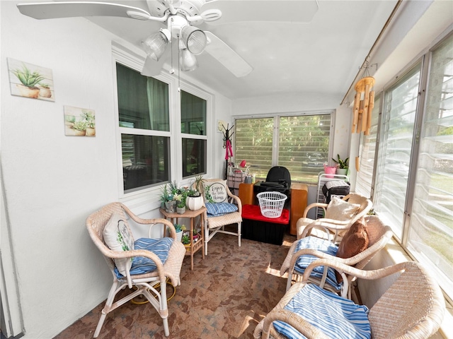 sunroom / solarium with a ceiling fan and plenty of natural light