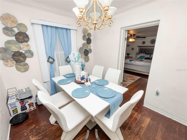 dining space featuring dark wood-style floors, crown molding, baseboards, and an inviting chandelier