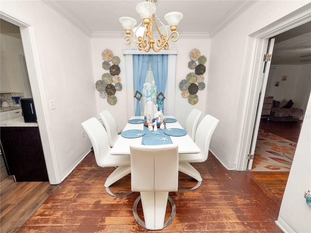 dining space with an inviting chandelier, baseboards, ornamental molding, and dark wood-style flooring