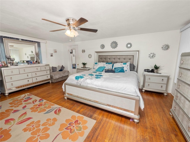 bedroom featuring ceiling fan and wood finished floors