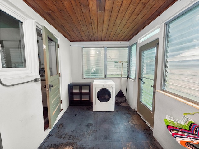 clothes washing area with washer / clothes dryer, wooden ceiling, and laundry area