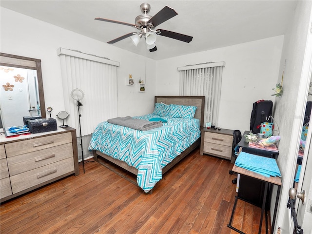 bedroom featuring ceiling fan and dark wood-style flooring