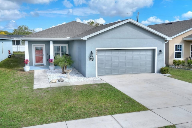 ranch-style house with a garage and a front lawn