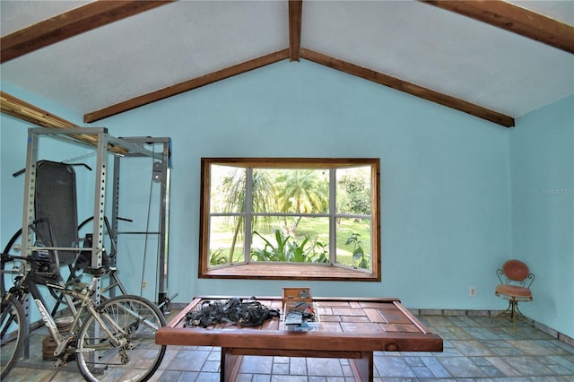 interior space with vaulted ceiling with beams