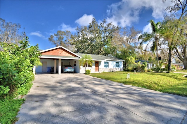 ranch-style house with a carport and a front yard