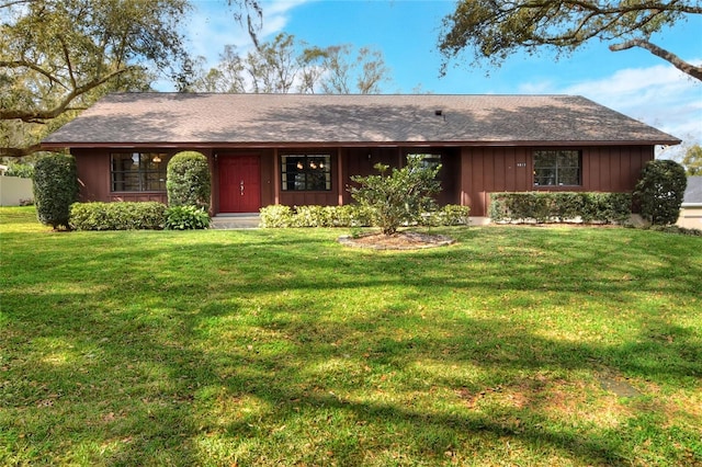 single story home with a front yard