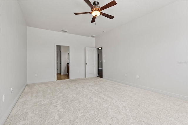 unfurnished bedroom with a ceiling fan, carpet, visible vents, and baseboards