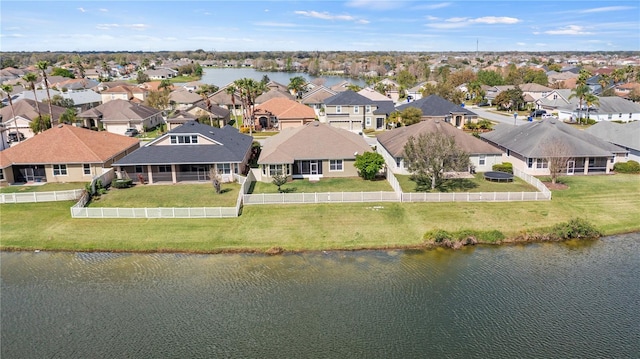 bird's eye view featuring a water view and a residential view