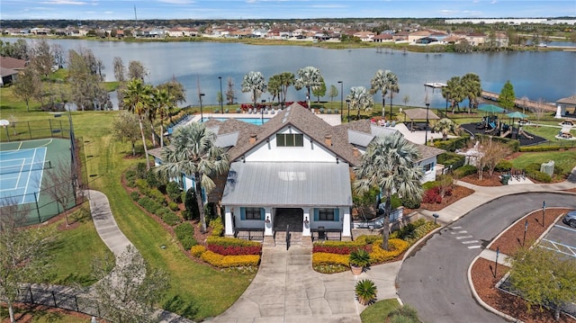 drone / aerial view featuring a residential view and a water view