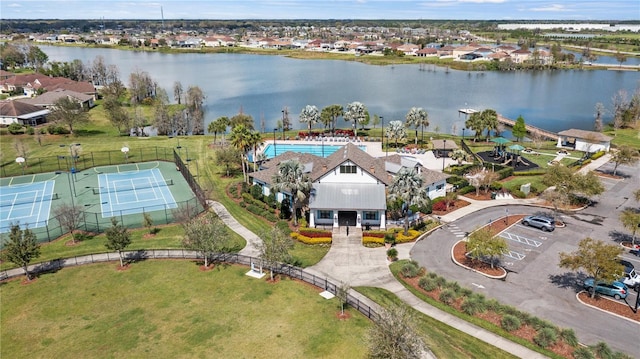 drone / aerial view featuring a water view and a residential view