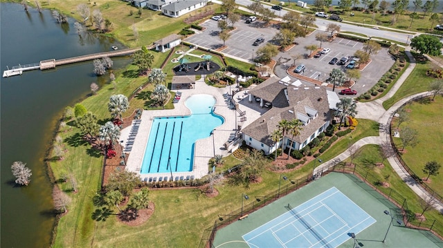 birds eye view of property with a water view