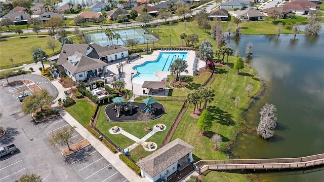 birds eye view of property with a residential view and a water view