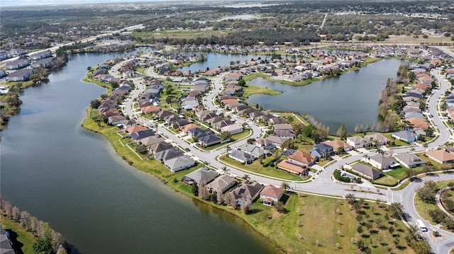 bird's eye view featuring a residential view and a water view