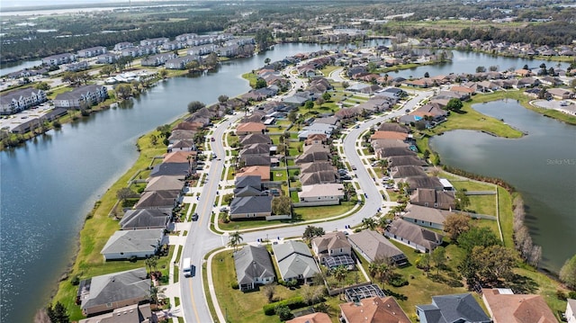 aerial view featuring a water view and a residential view