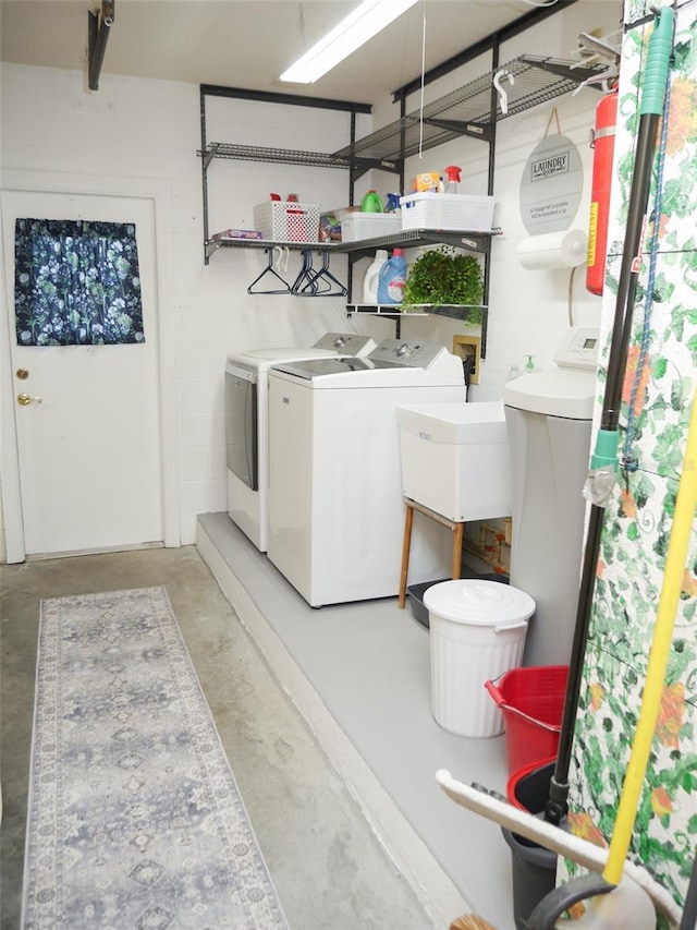 washroom with laundry area and washer and dryer