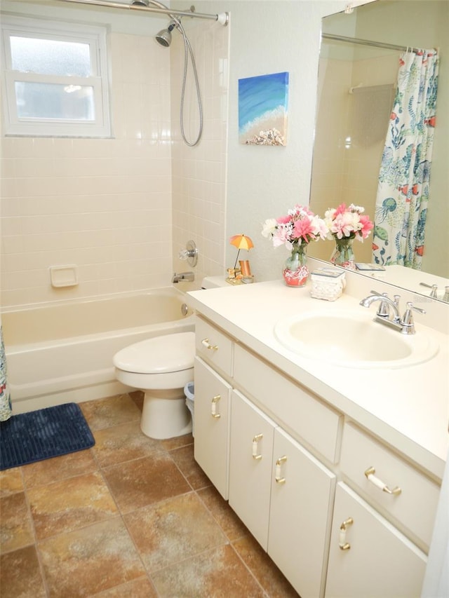 full bathroom featuring toilet, shower / bath combo, and vanity