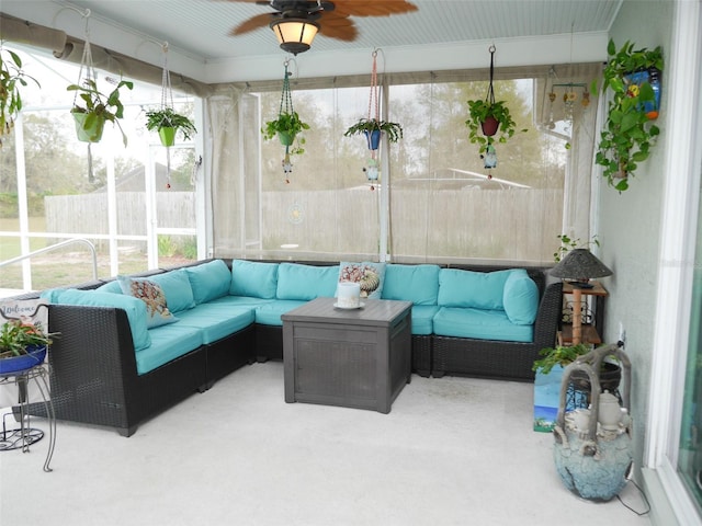 sunroom featuring ceiling fan