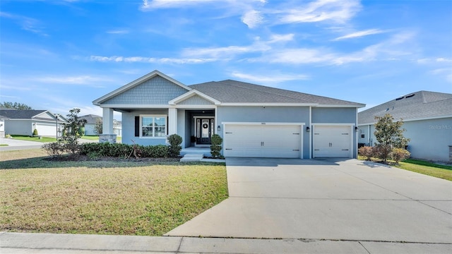 view of front of house featuring a garage and a front yard