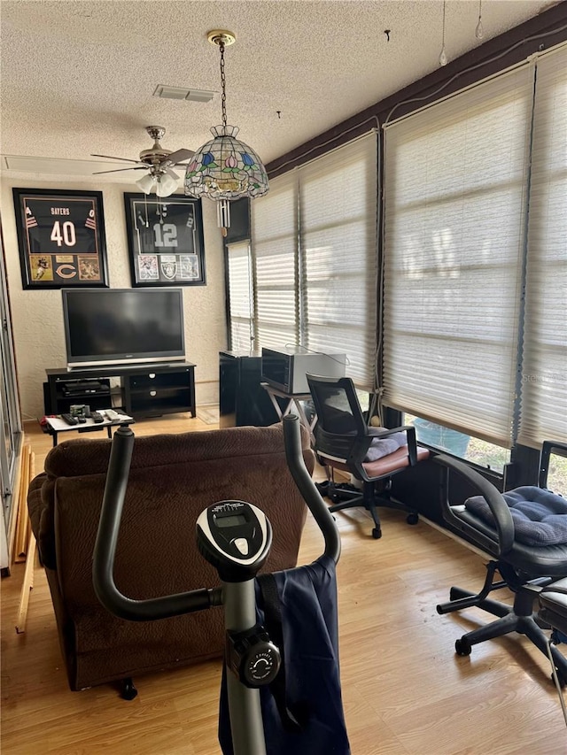 office featuring a textured ceiling and light hardwood / wood-style floors