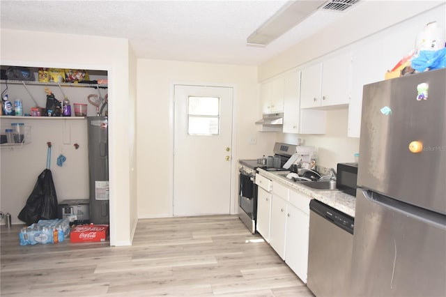 kitchen featuring under cabinet range hood, water heater, white cabinetry, and stainless steel appliances