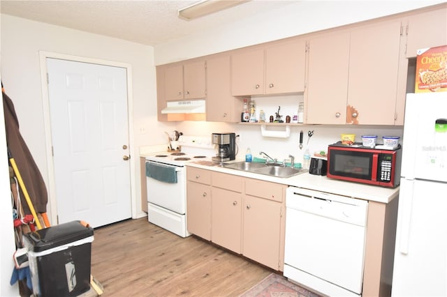 kitchen with white appliances, light countertops, under cabinet range hood, open shelves, and a sink