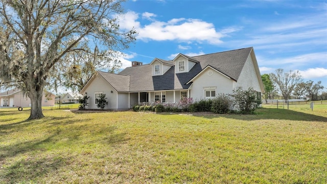 new england style home with a front yard